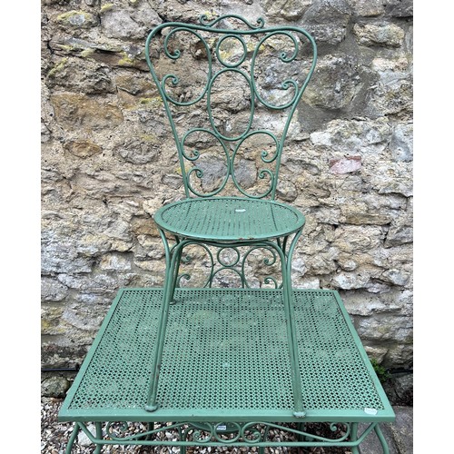 1092 - A painted metal table and four painted metal chairs (5)