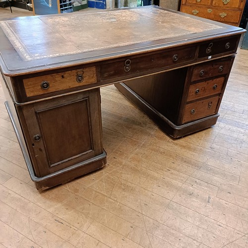 1037 - A 19th century mahogany partners desk, the top having six drawers, the pedestals having three drawer... 