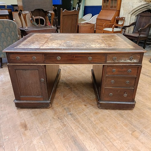 1037 - A 19th century mahogany partners desk, the top having six drawers, the pedestals having three drawer... 