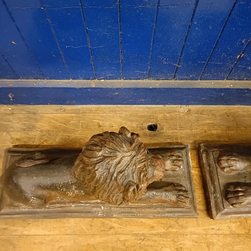 1081 - A pair of stoneware garden lions, on rectangular bases, 75 cm wide