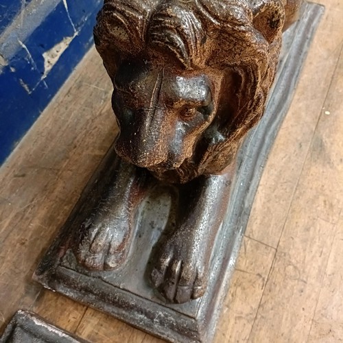 1081 - A pair of stoneware garden lions, on rectangular bases, 75 cm wide