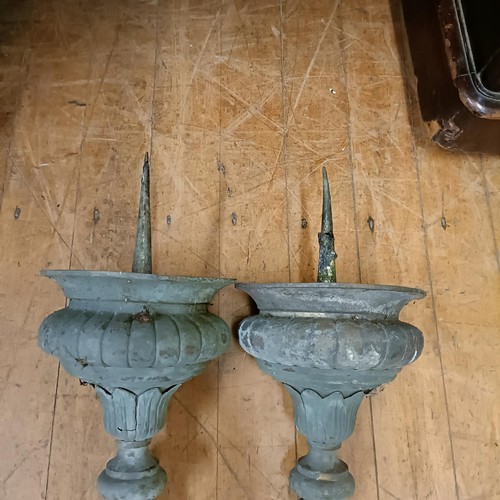 1041 - A large pair of wall mounted metal pricket candlesticks, decorated foliate forms, 50 cm wide (2)