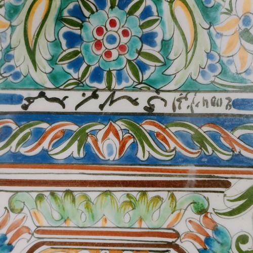 913 - A set of Islamic tiles, decorated vase and flowers, framed, 61 x 44 cm