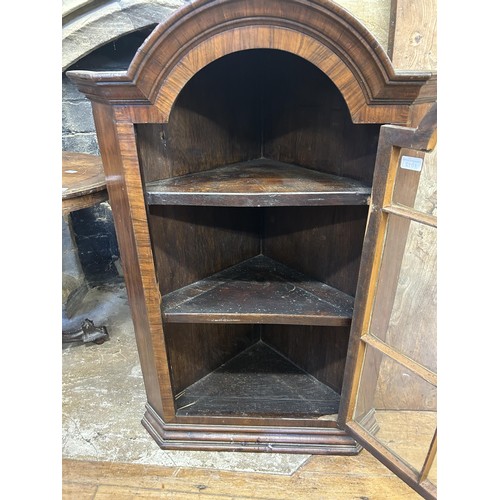 1012 - A walnut corner cabinet, with a glazed door, 70 cm wide