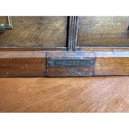 1043 - An unusual Canadian walnut filing cabinet, having eight drawers, with brass plaque reading Hart &... 