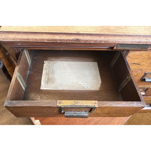 1043 - An unusual Canadian walnut filing cabinet, having eight drawers, with brass plaque reading Hart &... 