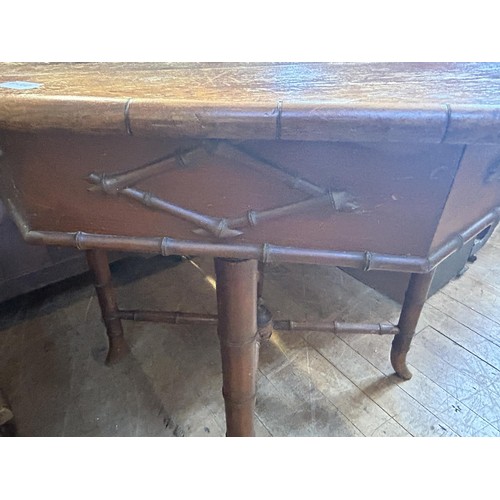 1073 - An unusual early 20th century, pine and bamboo octagonal centre table, 88 cm wide