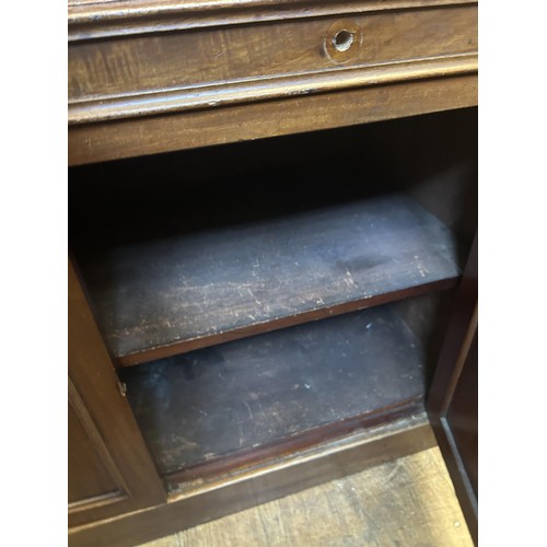 952 - A 19th century mahogany cylinder bookcase cabinet, the top having two glazed doors, above a cylinder... 