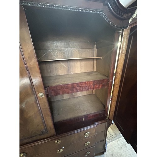 953 - An 18th century walnut armoire, with an architectural pediment, 170 cm wide