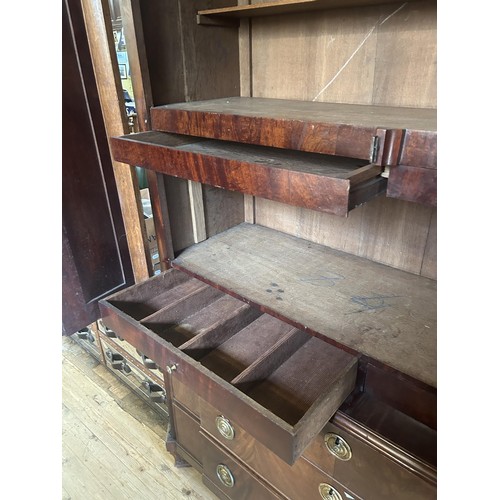 953 - An 18th century walnut armoire, with an architectural pediment, 170 cm wide