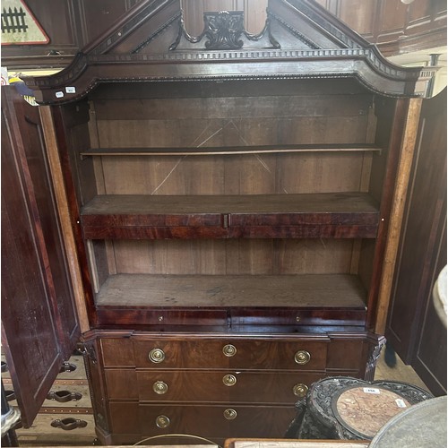 953 - An 18th century walnut armoire, with an architectural pediment, 170 cm wide