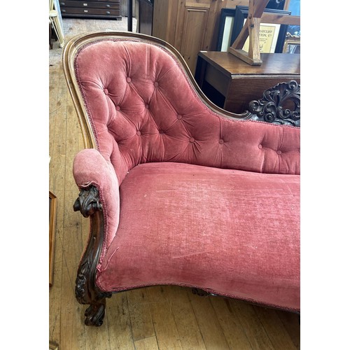 1031 - A Victorian rosewood framed settee, with a carved frame, 194 cm wide