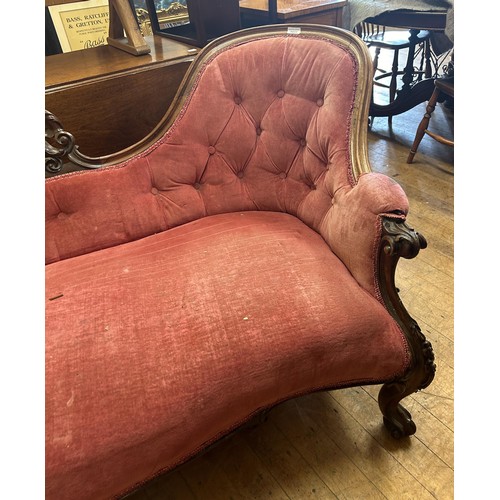 1031 - A Victorian rosewood framed settee, with a carved frame, 194 cm wide