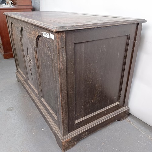 4 - An oak coffer, the front carved pomegranate, 126 cm wide