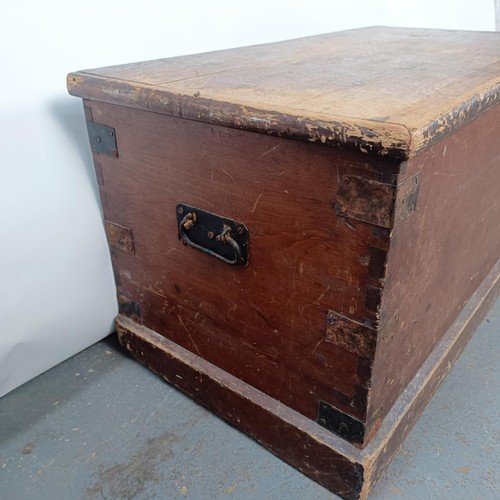 6 - A Victorian stained pine trunk, with metal mounts, 84 cm wide