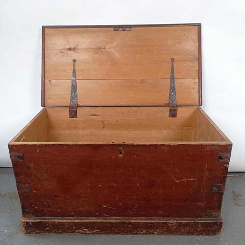 6 - A Victorian stained pine trunk, with metal mounts, 84 cm wide