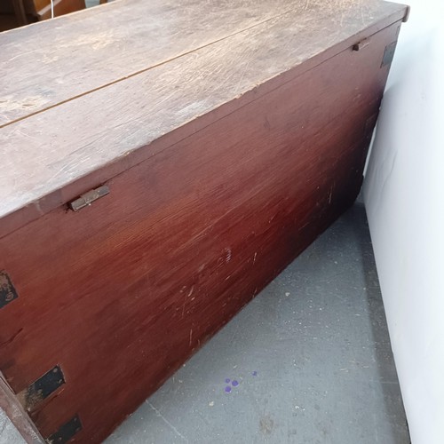 6 - A Victorian stained pine trunk, with metal mounts, 84 cm wide