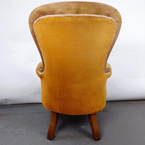 11 - A Victorian mahogany framed button back armchair