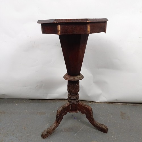 13 - A Victorian walnut work table, top inset with a chess board, 42 cm wide