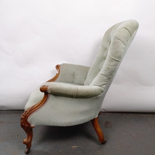 16 - A Victorian mahogany framed button back armchair, in need of extensive restoration