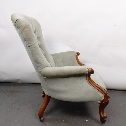 16 - A Victorian mahogany framed button back armchair, in need of extensive restoration