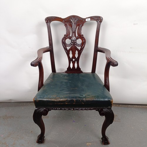 19 - A mahogany Chippendale style armchair, with a padded seat