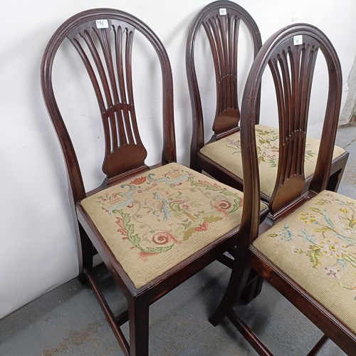 20 - A set of three mahogany hoop back dining chairs, with tapestry drop in seats