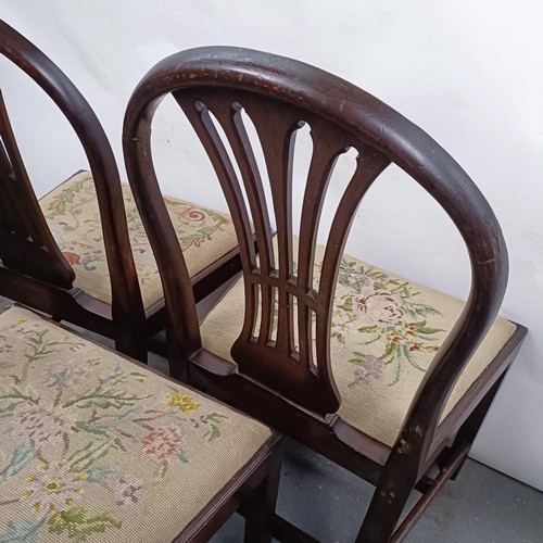 20 - A set of three mahogany hoop back dining chairs, with tapestry drop in seats