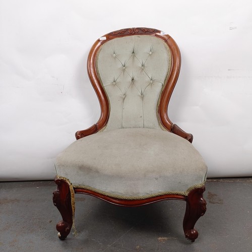 21 - A Victorian walnut framed nursing chair