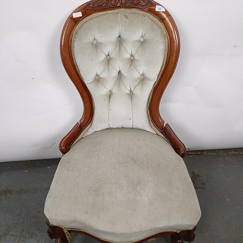 21 - A Victorian walnut framed nursing chair