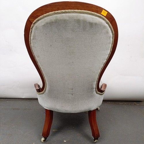 21 - A Victorian walnut framed nursing chair