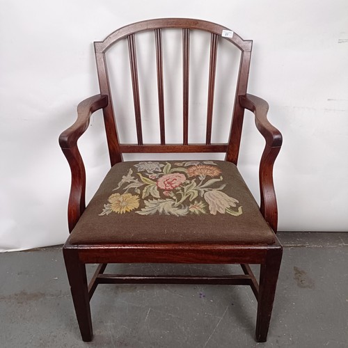 27 - A mahogany rail back armchair, with a tapestry drop in seat