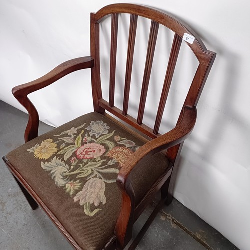 27 - A mahogany rail back armchair, with a tapestry drop in seat