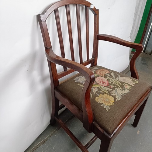 27 - A mahogany rail back armchair, with a tapestry drop in seat