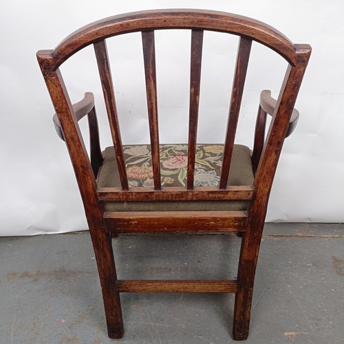 27 - A mahogany rail back armchair, with a tapestry drop in seat