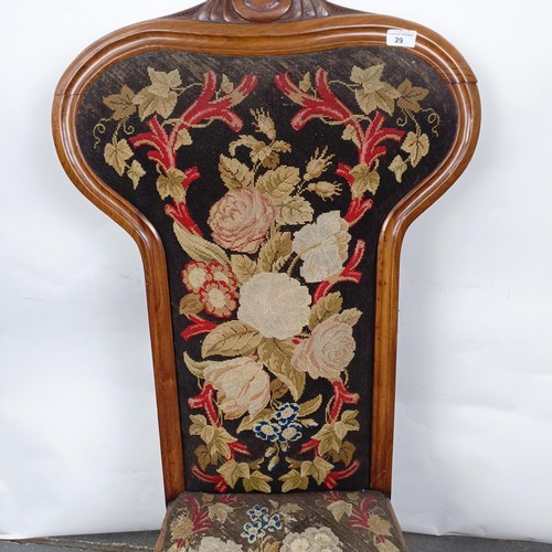 29 - A 19th century Continental nursing chair, with a carved top rail, with a tapestry back and seat, 105... 