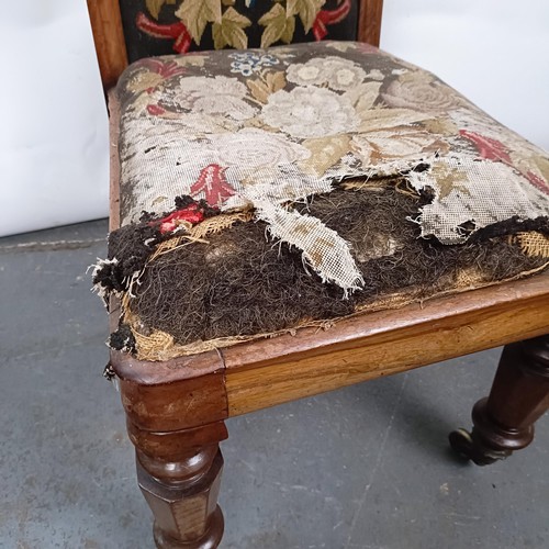 29 - A 19th century Continental nursing chair, with a carved top rail, with a tapestry back and seat, 105... 