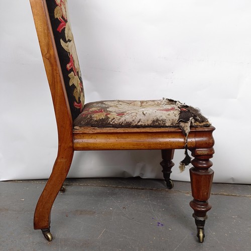 29 - A 19th century Continental nursing chair, with a carved top rail, with a tapestry back and seat, 105... 