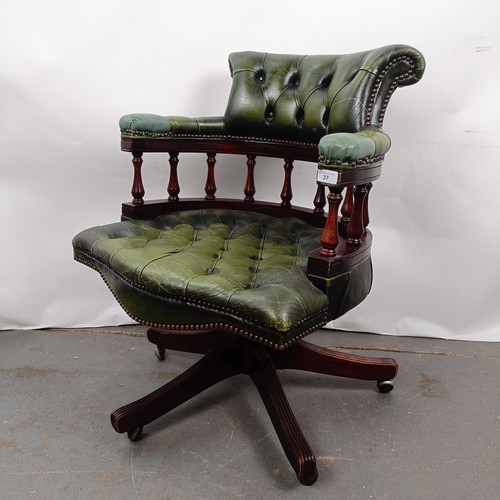 37 - A mahogany and green leather desk chair