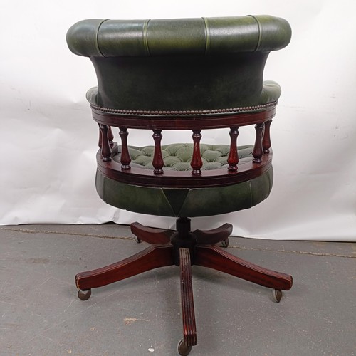 37 - A mahogany and green leather desk chair