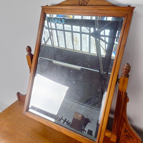 36 - A Victorian satinw walnut dressing chest, having a mirrored back, on a base with two short and three... 