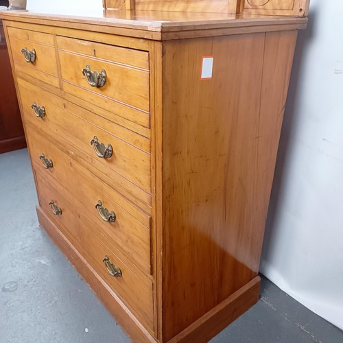 36 - A Victorian satinw walnut dressing chest, having a mirrored back, on a base with two short and three... 