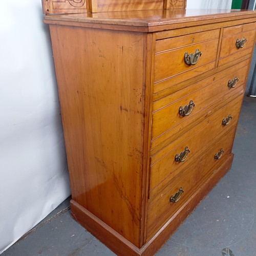 36 - A Victorian satinw walnut dressing chest, having a mirrored back, on a base with two short and three... 