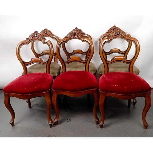 38 - A set of six Victorian mahogany framed dining chairs, with carved top rails, padded seats and cabrio... 