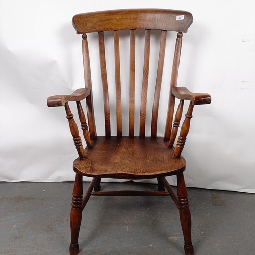 43 - A Victorian Windsor style kitchen armchair