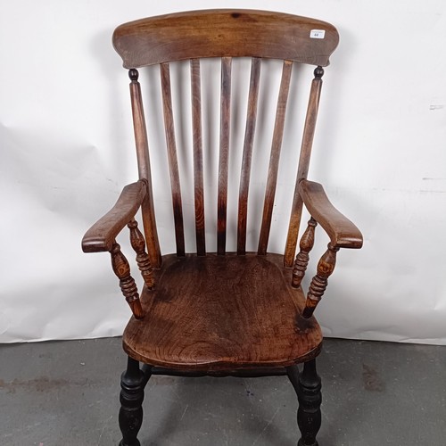 44 - A Victorian Windsor style kithcen armchair