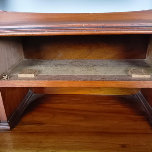 45 - An Art Nouveau style walnut dressing chest, having three long drawers, 156 cm high x 94 cm wide