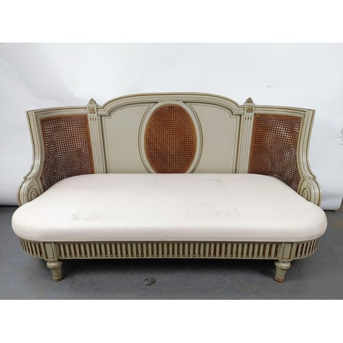 46 - A Continental two seater sofa, with a painted and canework frame, 146 cm wide