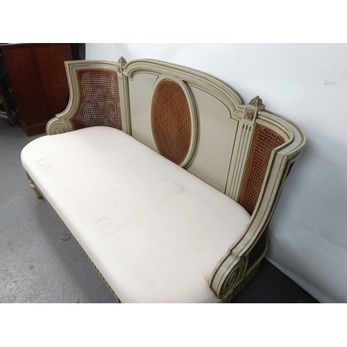 46 - A Continental two seater sofa, with a painted and canework frame, 146 cm wide