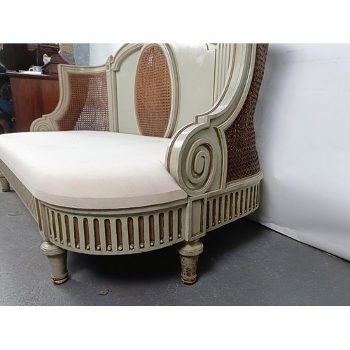 46 - A Continental two seater sofa, with a painted and canework frame, 146 cm wide